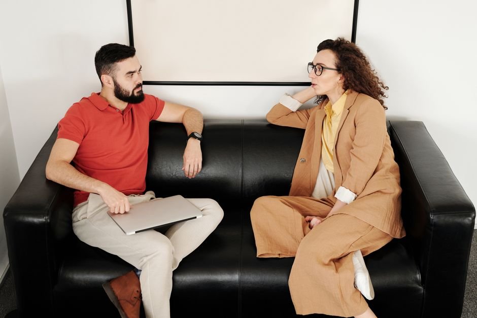 EMDR therapy: Two people talking office warm